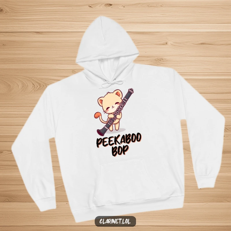 Funny hoodie print of a shy creature peeking shyly from behind a clarinet, tail in a gentle wag. Cozy gift.